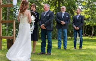 Bride facing her groom during an emotional outdoor wedding ceremony in Edmonton
