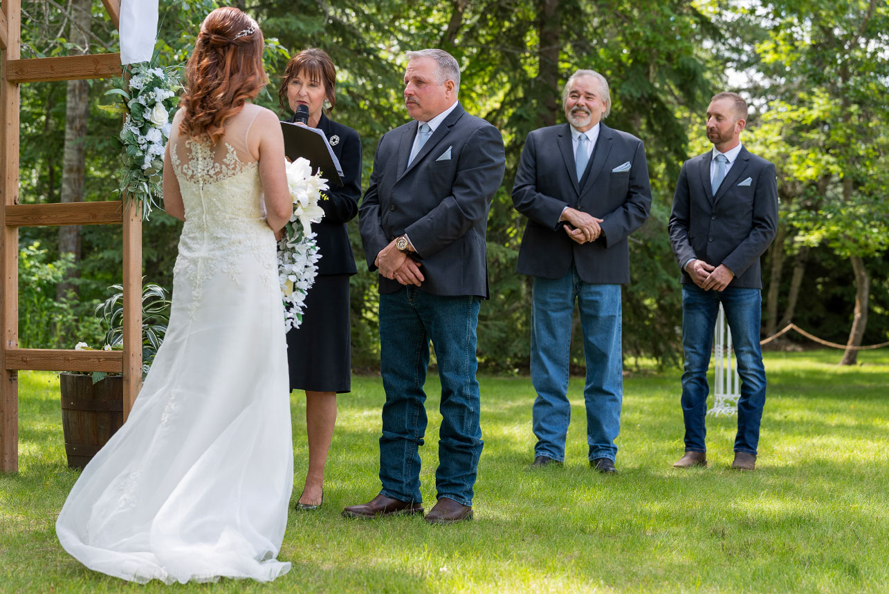 Bride facing her groom during an emotional outdoor wedding ceremony in Edmonton