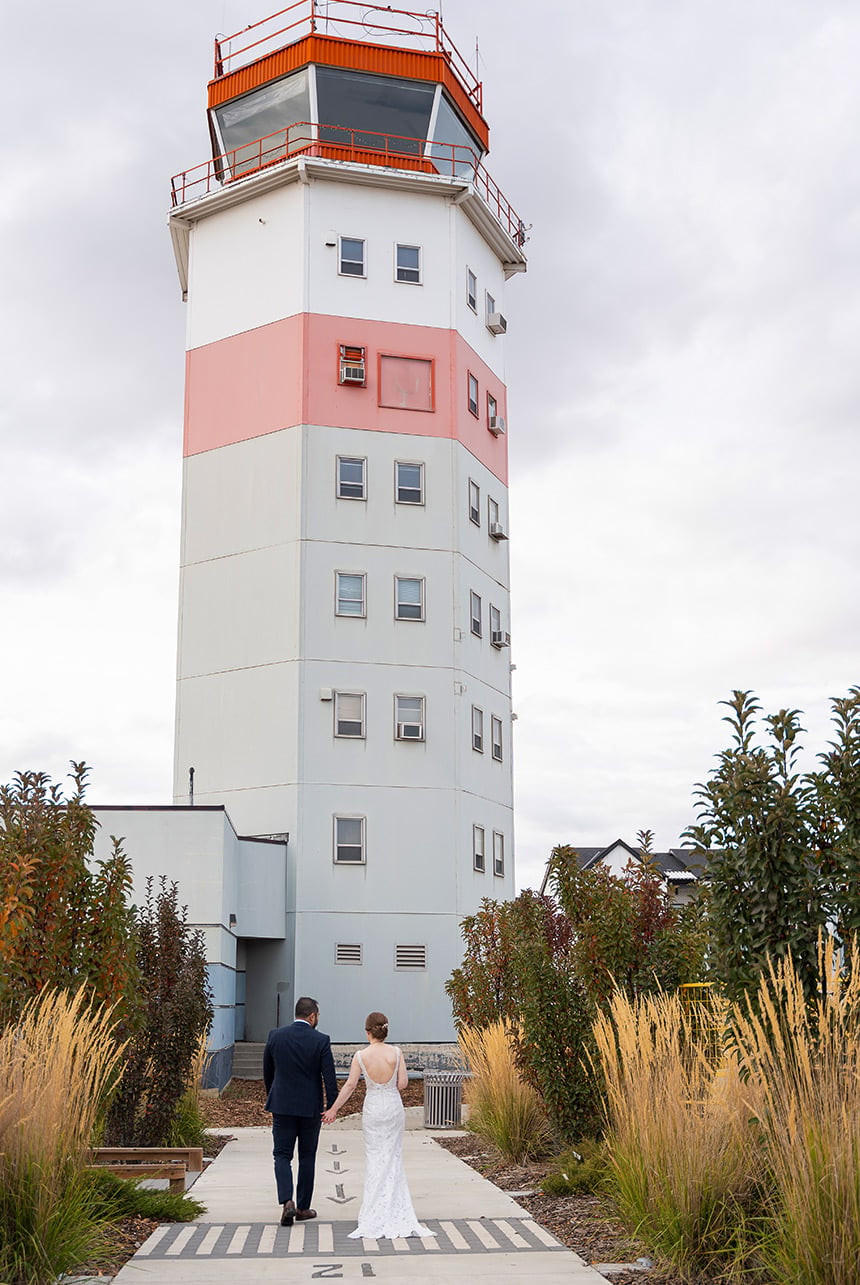 Bride and groom portrait near Blatchford tower in Edmonton