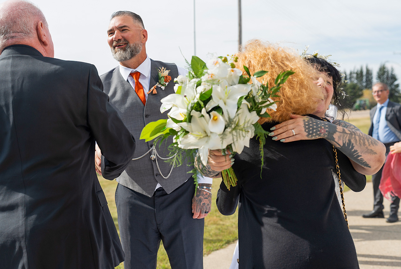 Trudy and Byron greeting guests after their wedding ceremony at St. Paul’s Lutheran Church in Rolly View.